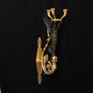 Applique Empire en bronze doré et patiné à la Renommée, XIXème siècle