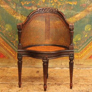 Fauteuil de bureau canné dit  'Couillard' en merisier laqué noir, époque Louis XVI