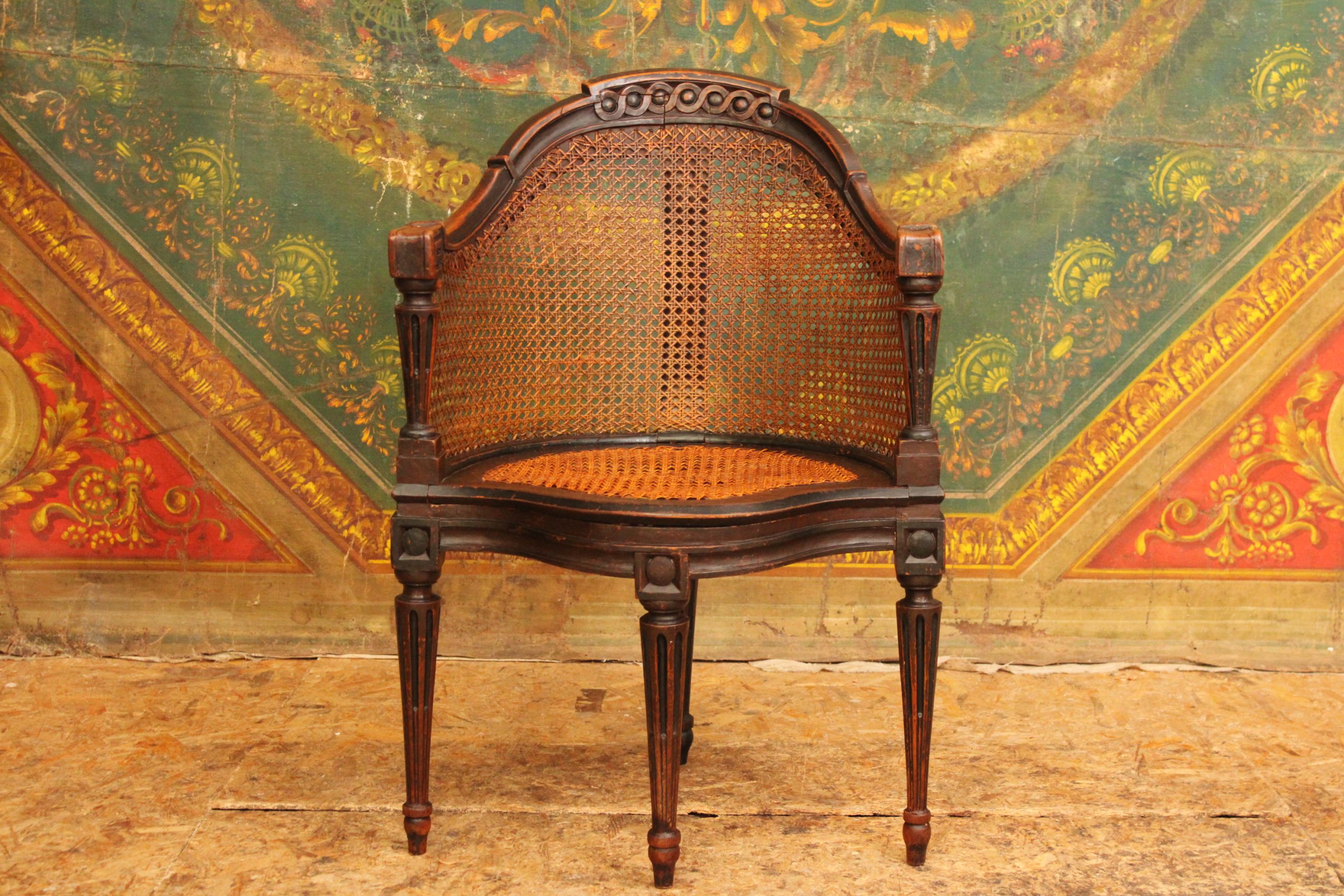 Fauteuil de bureau canné dit 'Couillard' en merisier laqué noir, époque Louis XVI